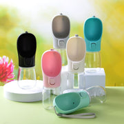 Pet portable water cups in various colors, including black, gray, pink, green, and turquoise, set against a bright background.