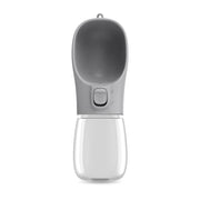 Gray portable pet water cup for cats with a top bowl and button, ideal for on-the-go hydration.