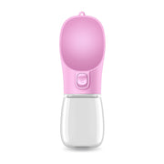 Portable pink water cup for pets, designed for easy hydration on the go.